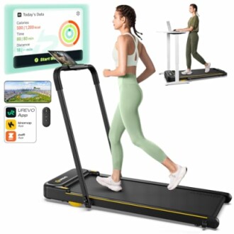 Woman running on a compact treadmill with a desk setup in the background.