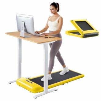 Woman using a treadmill desk with a computer, compact treadmill shown folded.