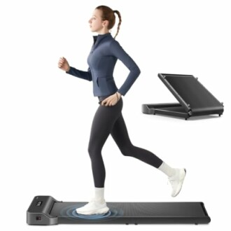 Person jogging on a foldable treadmill with a walking pad.