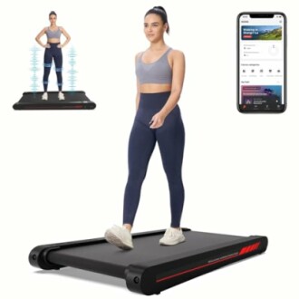 Woman using smart treadmill with fitness app on phone.
