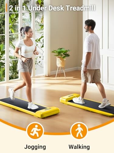 Two people using an under-desk treadmill, one jogging and one walking.