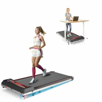 Two women using a walking pad treadmill, one exercising and the other working at a desk.