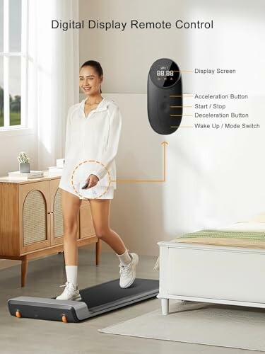 Woman walking on treadmill with digital remote control display.